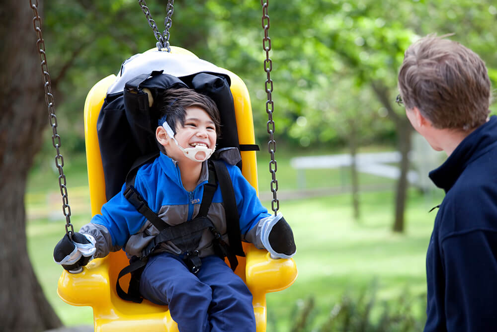 Child on swing smiling